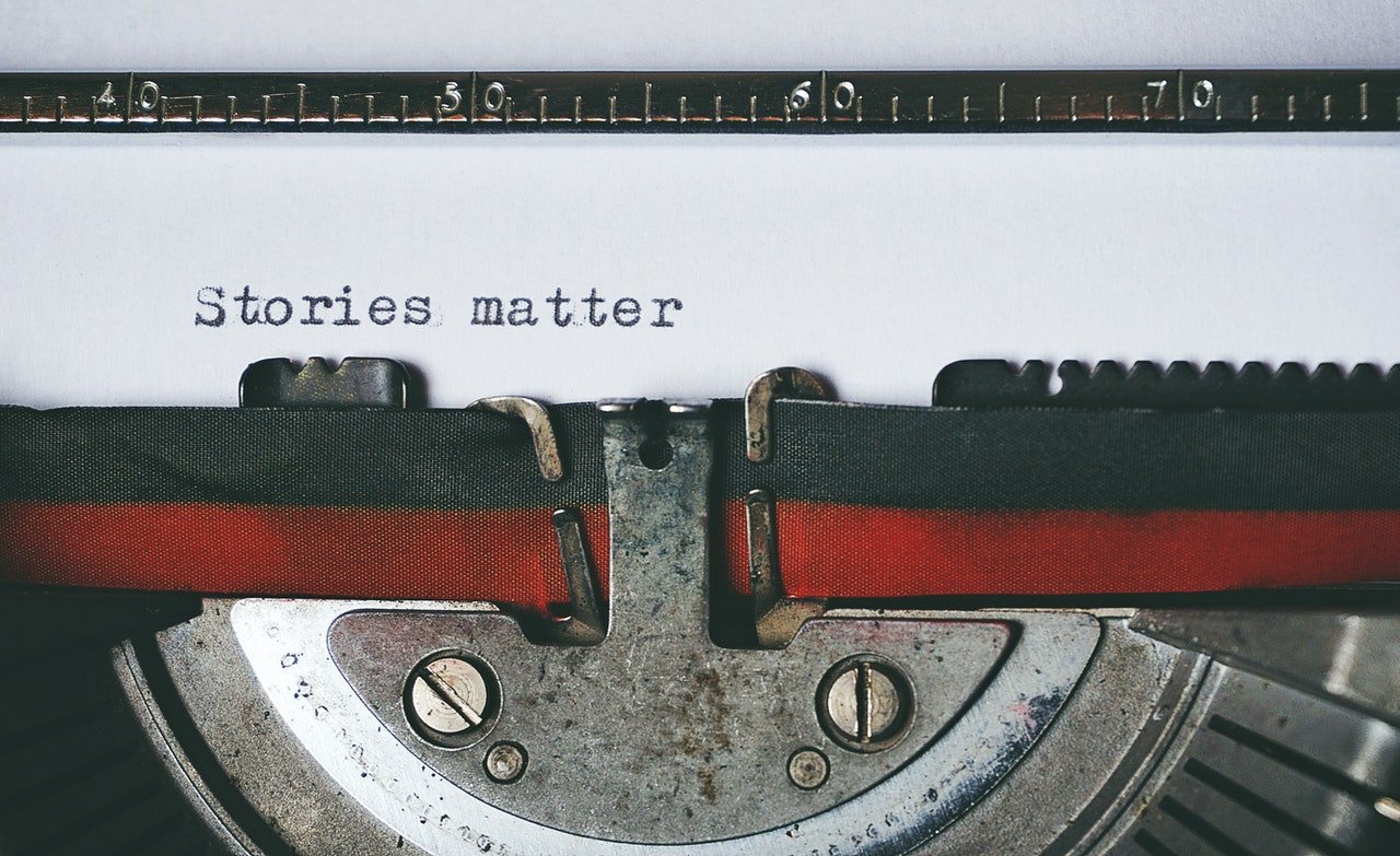 Typewriter typing "Stories Matter", photo for writing comics on the web article
